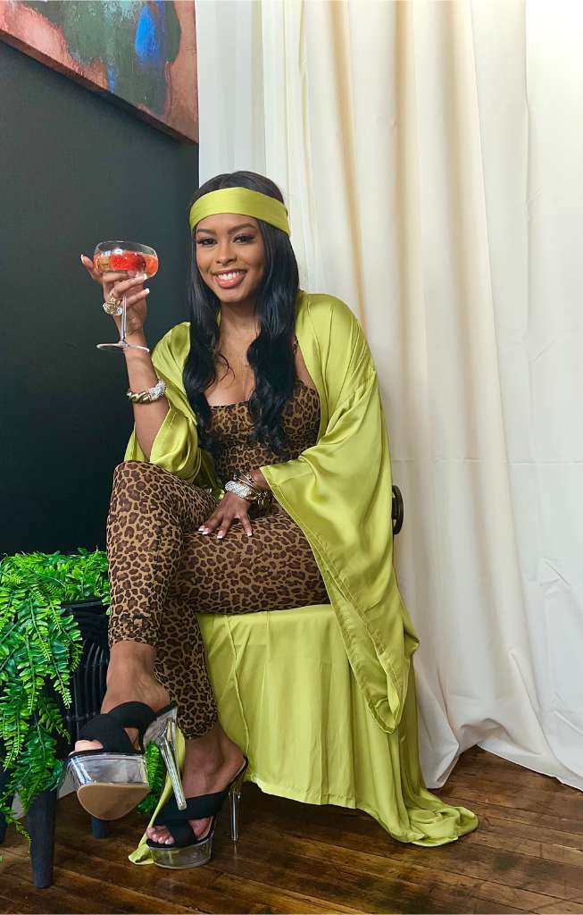 black girl luxury in robe at home