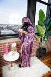 black woman in robe at home